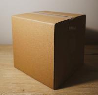A cardboard box secured with clear tape.