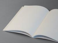 An open exercise book with blank pages.