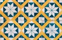 A tiled pattern of triangles and squares.