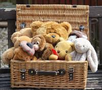 A collection of teddies in a hamper.