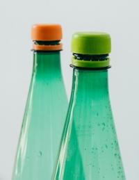 Two green plastic bottles.