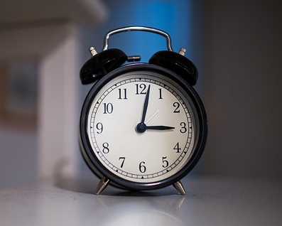 An old-fashioned alarm clock.