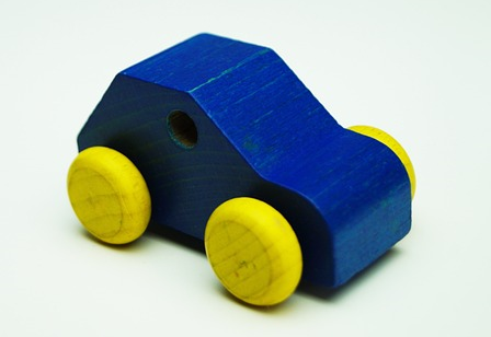 A small blue wooden car.
