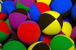 Multicoloured juggling balls.
