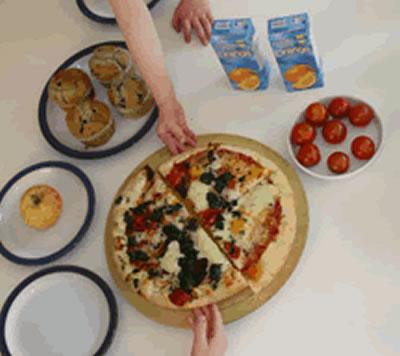 Four muffins. Two orange juices. Eight tomatoes. A pizza, cut into four slices. One apple.
