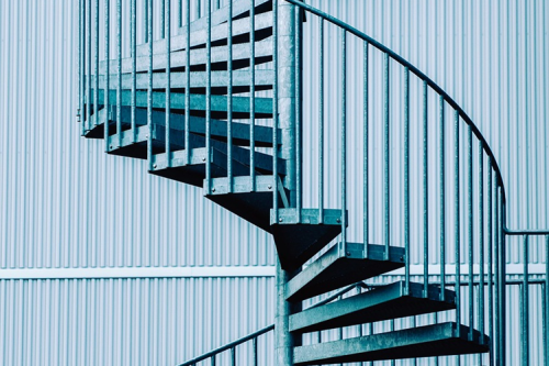 A blue spiral staircase.