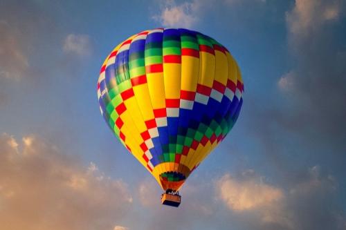 A colourful hot air balloon in the sky.